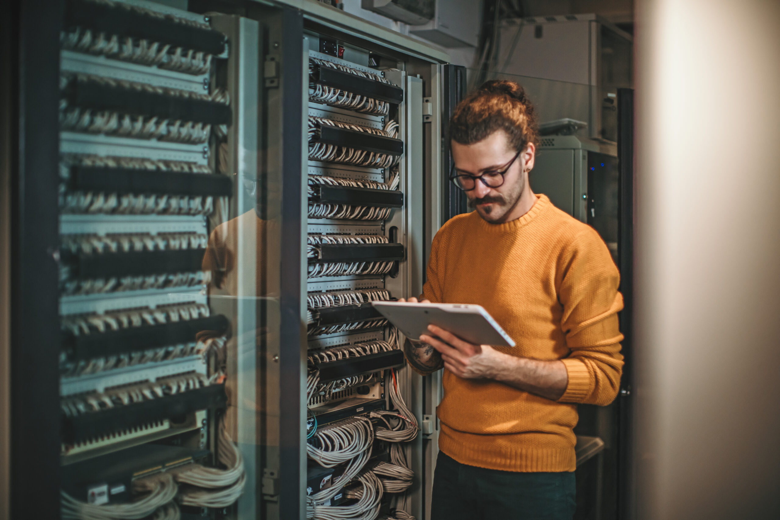 Male Caucasian IT technician in server room