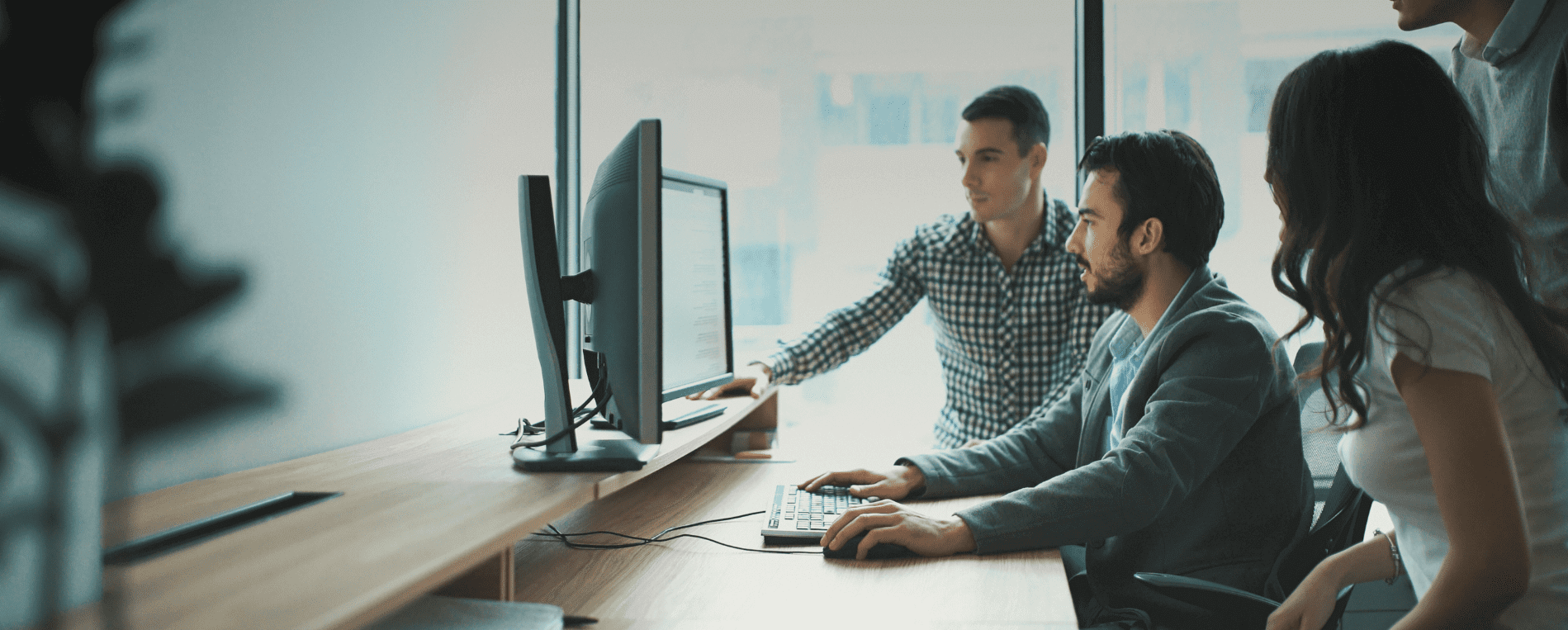 Group looking at computer screen