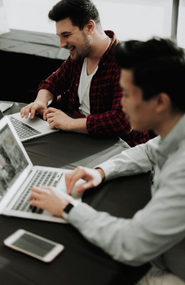 Men typing on laptop