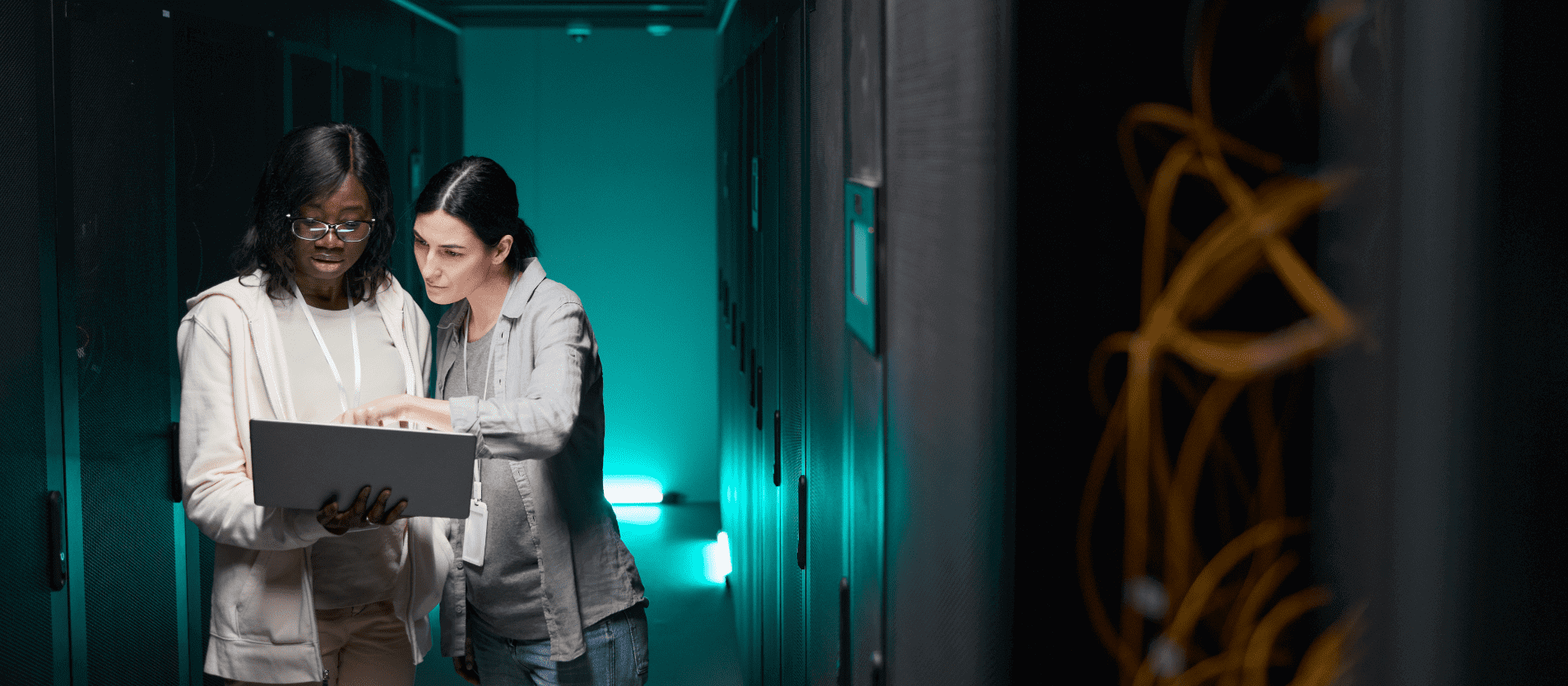 Two women looking at laptop