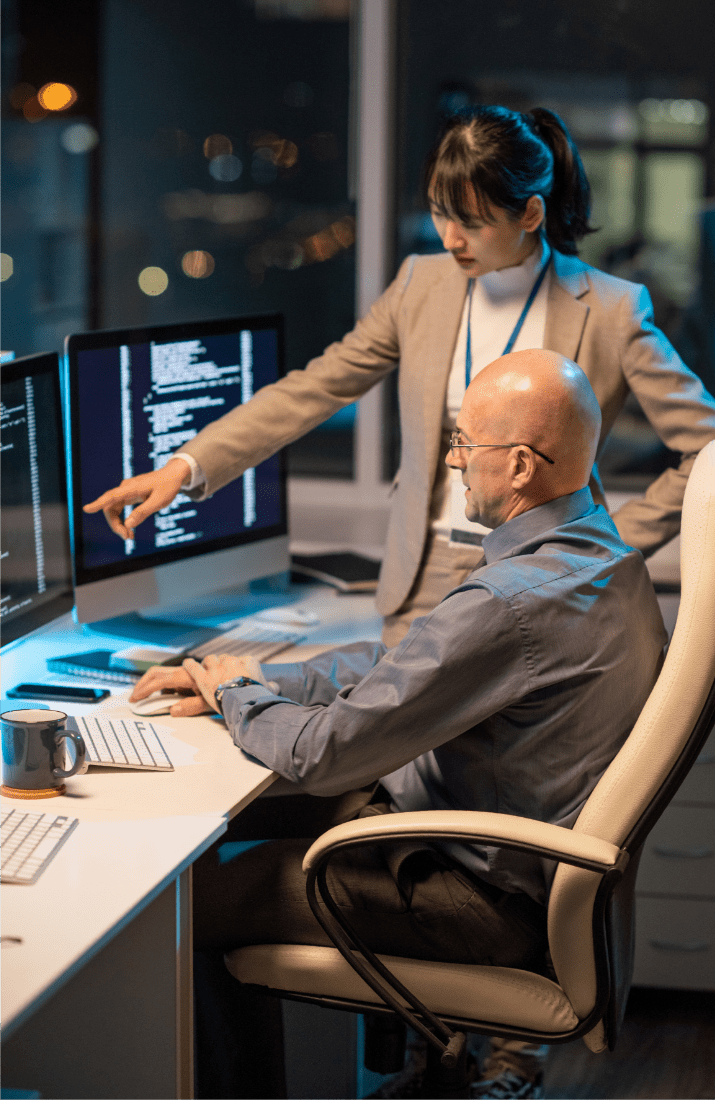 Woman and man looking at computer screen