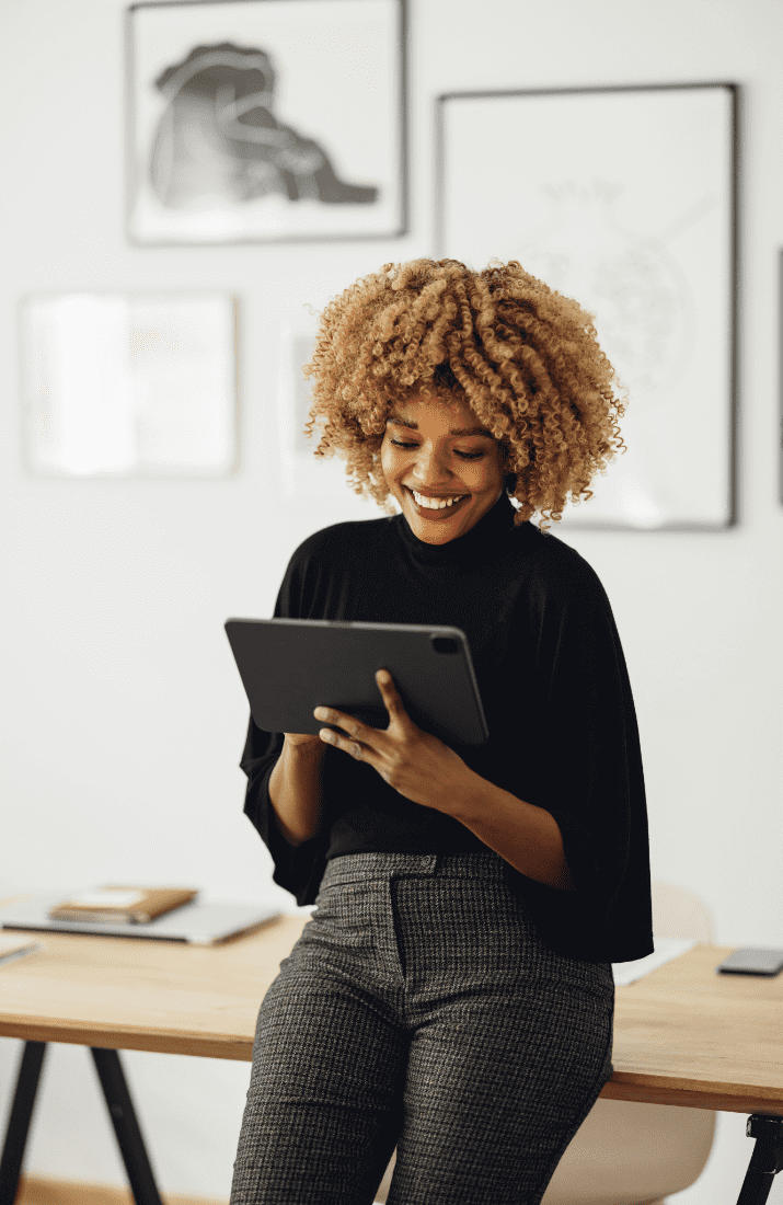 Woman smiling at tablet