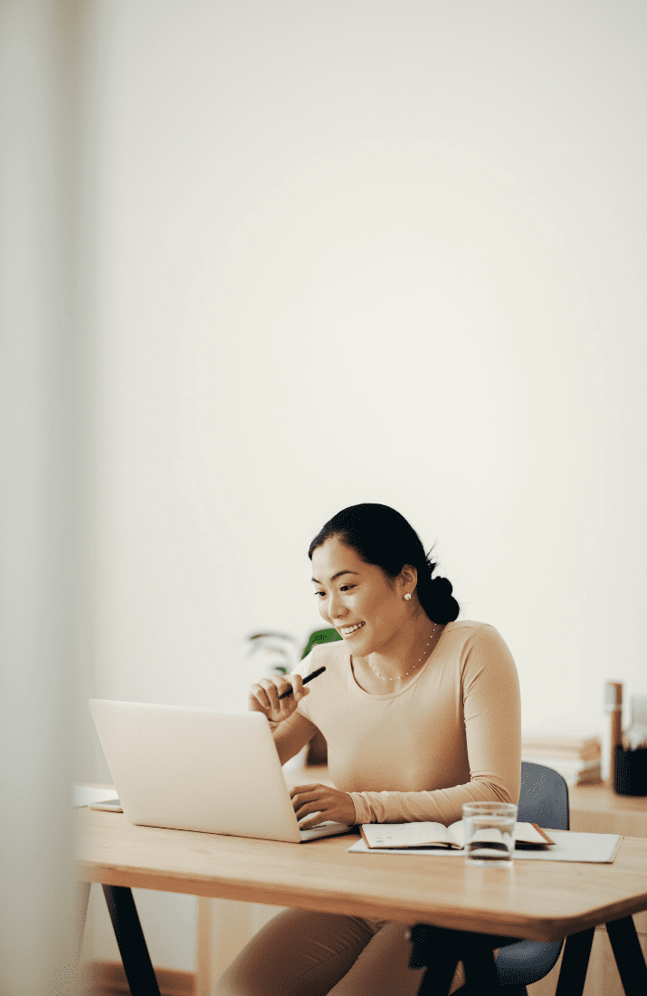 Woman smiling at laptop