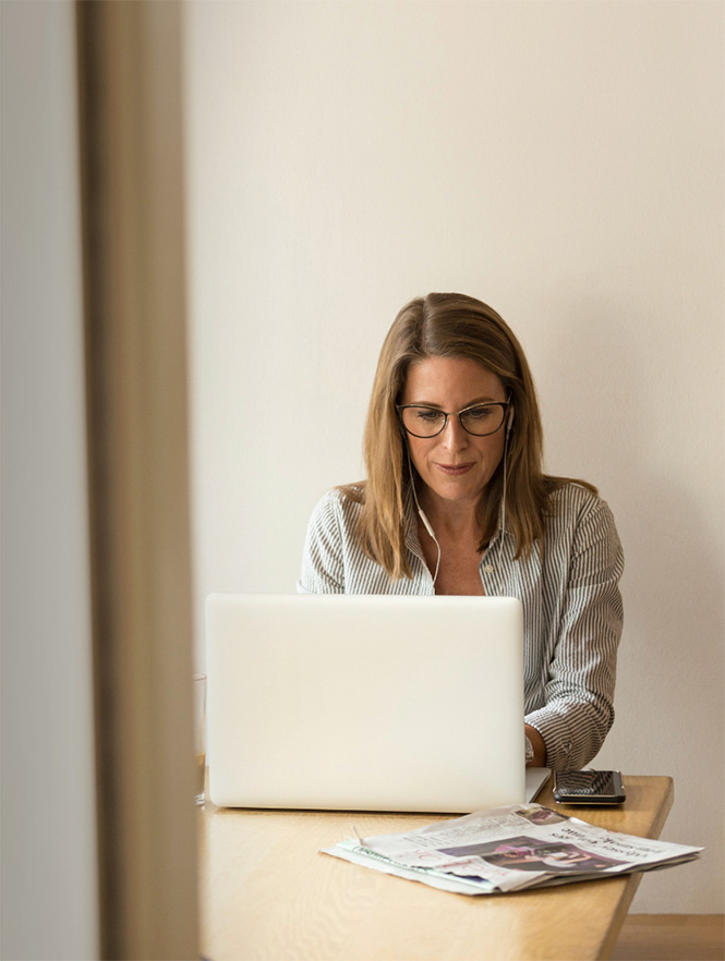 Woman looking at laptop