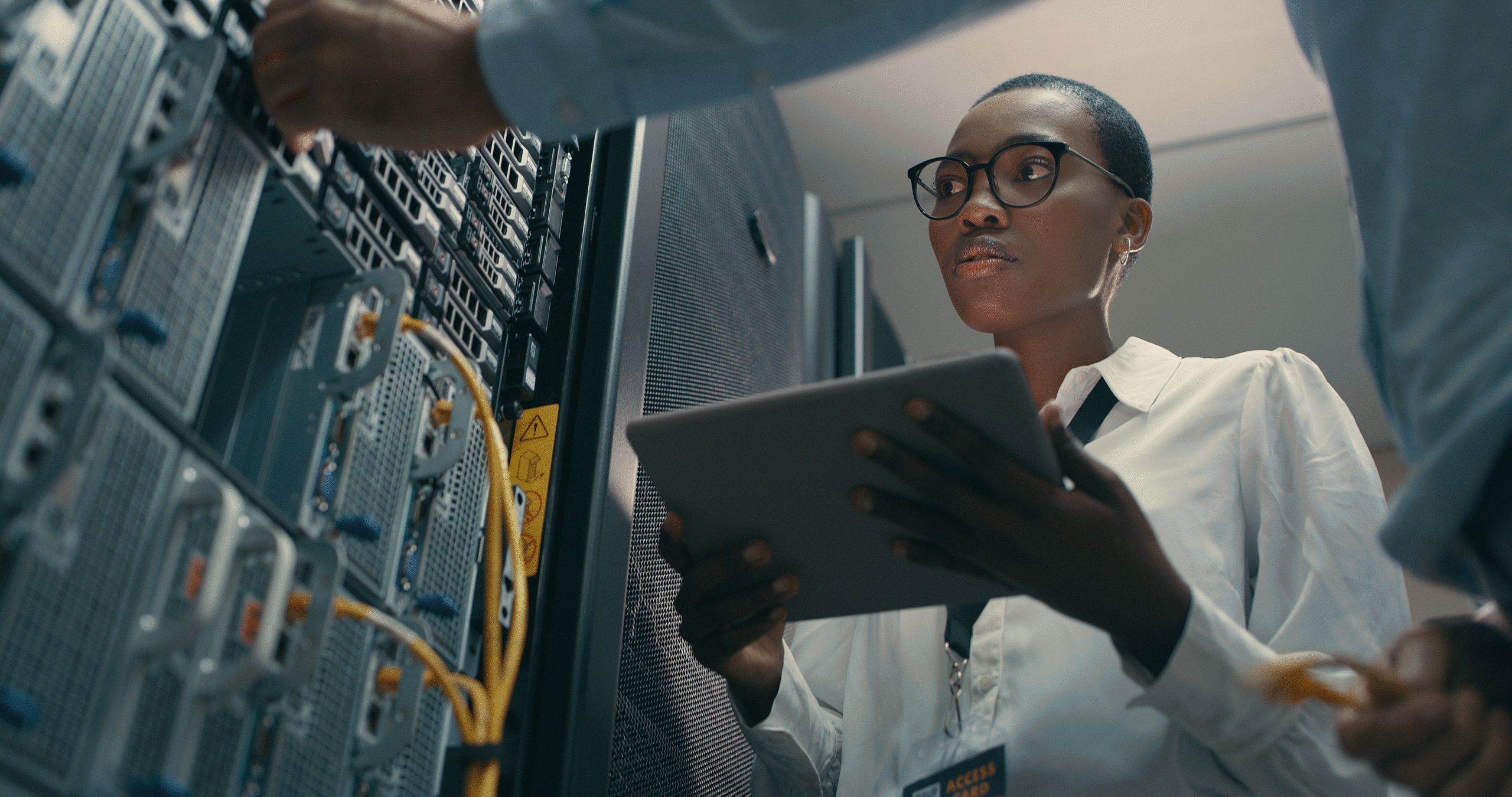 Security professional working in a server room